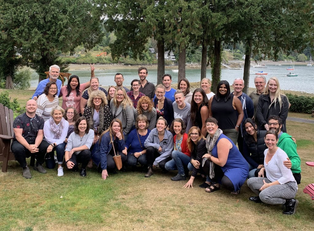 A large group of non-profit representatives pose for a photo at the end of the 2019 SVP Retreat