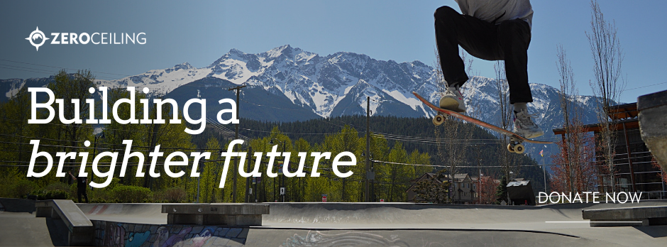 a young man does a skateboard trick against the majestic Tszil Mountain in Pemberton, BC. He is part of our programs!