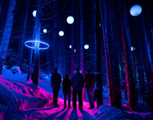 A group of Whistler locals stand beneath the colourful lights at Vallea Lumina to raise funds for ZC.