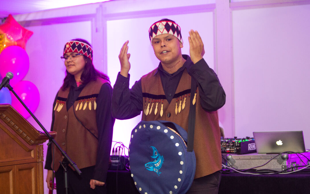 two Culture Ambassadors from the Squamish Lilwat Cultural Centre perform at our 25th Birthday Family Dinner event in November 2022